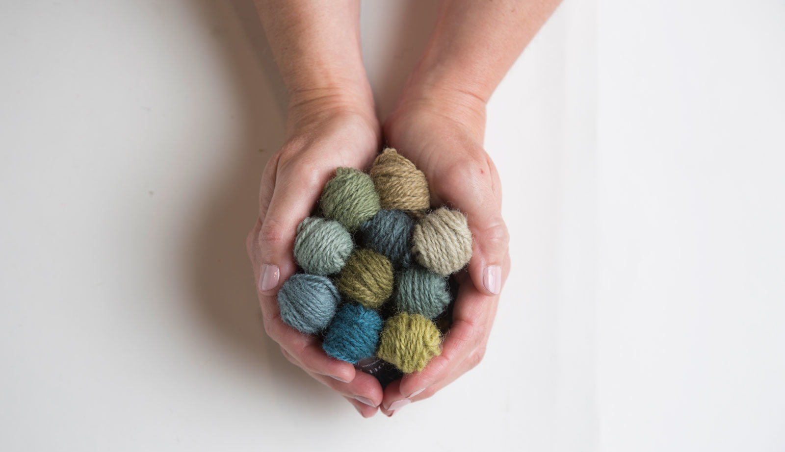 Scott-Group-Studio-Rugs-Blog-Made-In-America-Hands-Holding-Poms