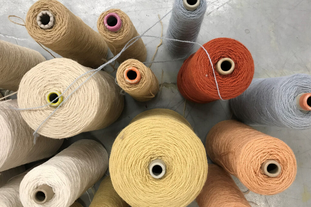 Scott-Group-Studio-Rugs-Yarn-Spindles-Orange-Yellow-Coral-Grey